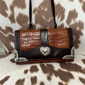 Barely used crossbody wallet style purse.